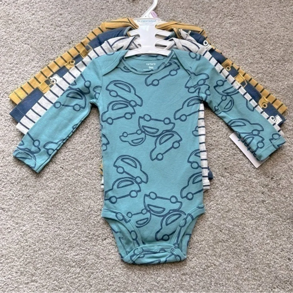 NWT Carter’s baby size 9 months four pc. Long sleeve onesies